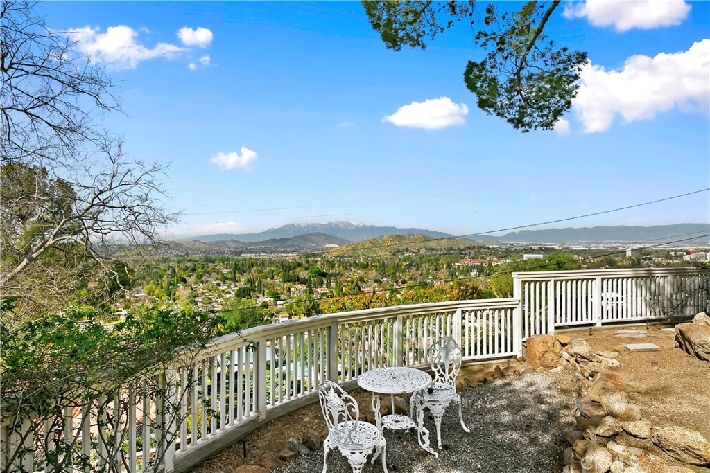 3124 Pachappa Drive Riverside, CA 92506 - Photo 45 of 50 a view of a balcony with chair and wooden floor
