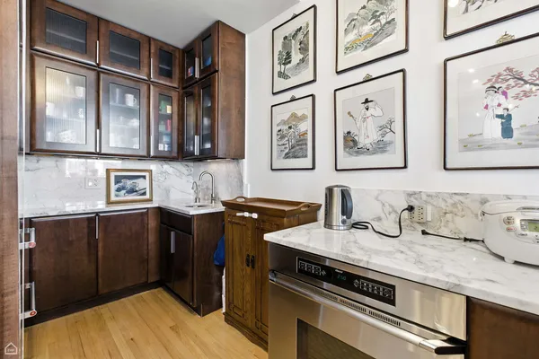 a kitchen with stainless steel appliances granite countertop a stove and a refrigerator