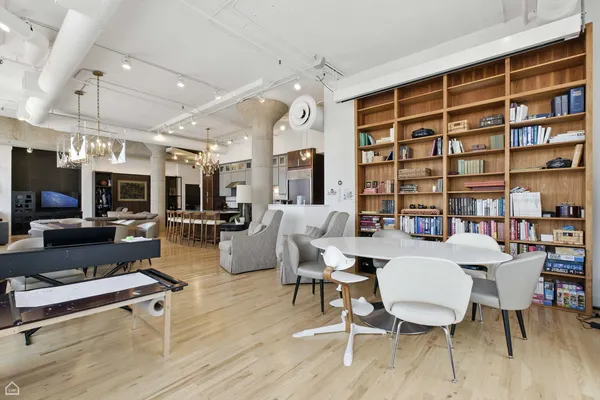 a living room with furniture a rug and a flat screen tv