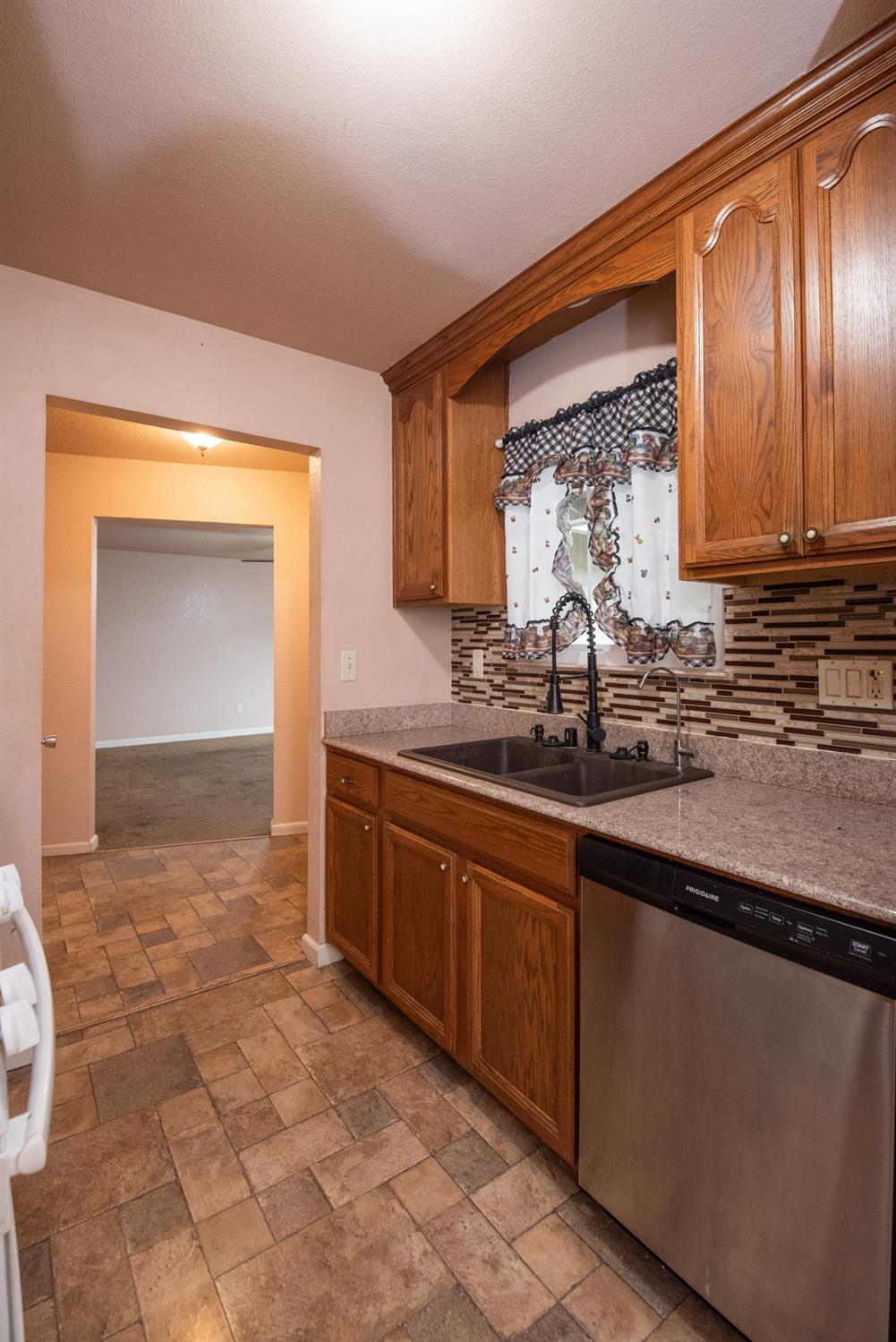 404 Trask Lane Modesto, CA 95354 - Photo 19 of 25 a bathroom with a sink and a mirror