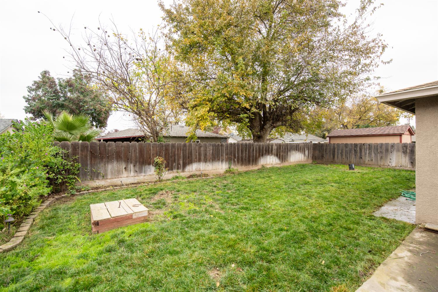 404 Trask Lane Modesto, CA 95354 - Photo 24 of 25 a view of a backyard with a garden