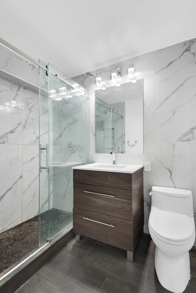530 East 72nd Street, Unit 3F Manhattan, NY 10021 - Photo 13 of 16 a bathroom with a sink toilet and shower
