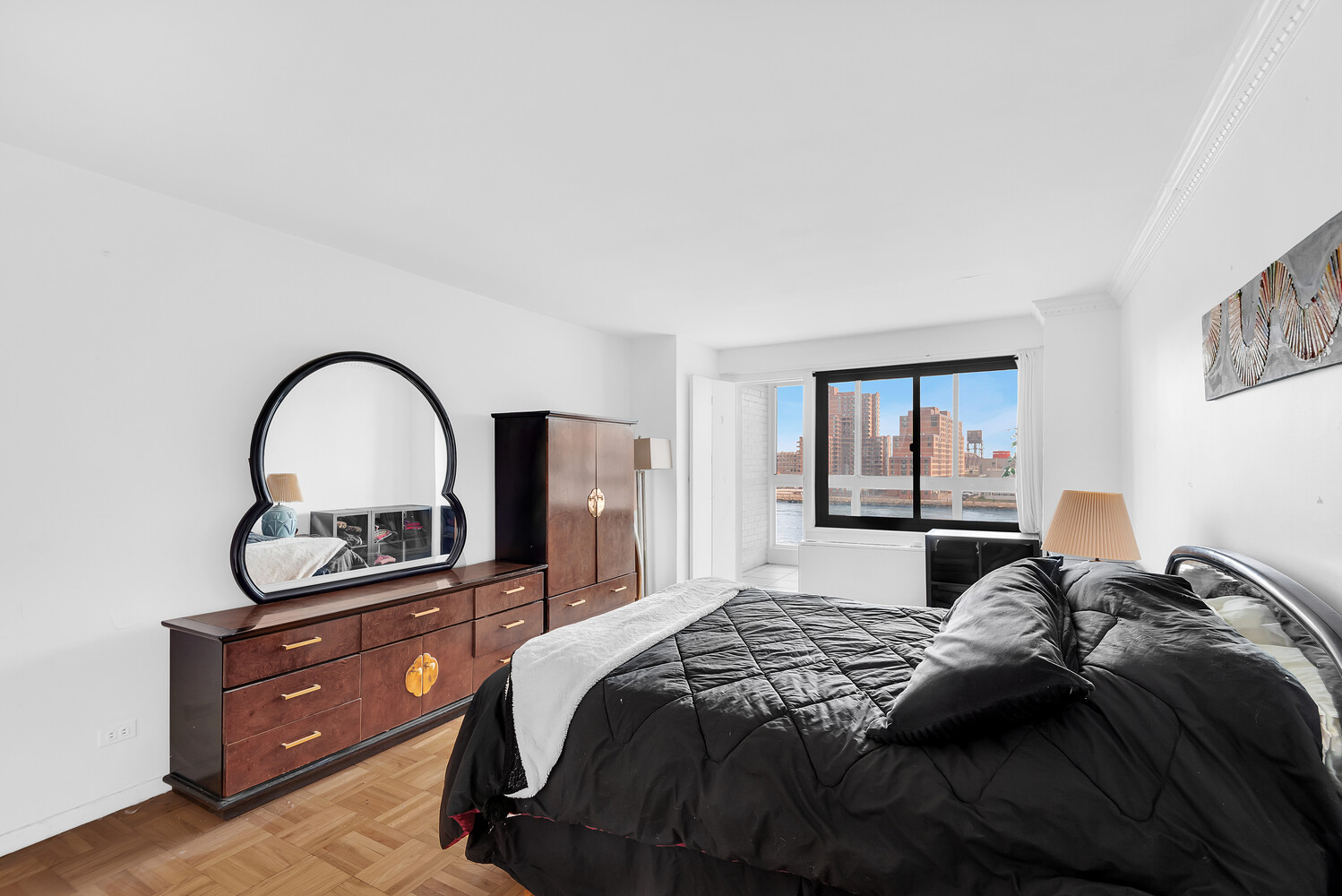 530 East 72nd Street, Unit 3F Manhattan, NY 10021 - Photo 8 of 16 a bedroom with a bed and a dresser next to a window