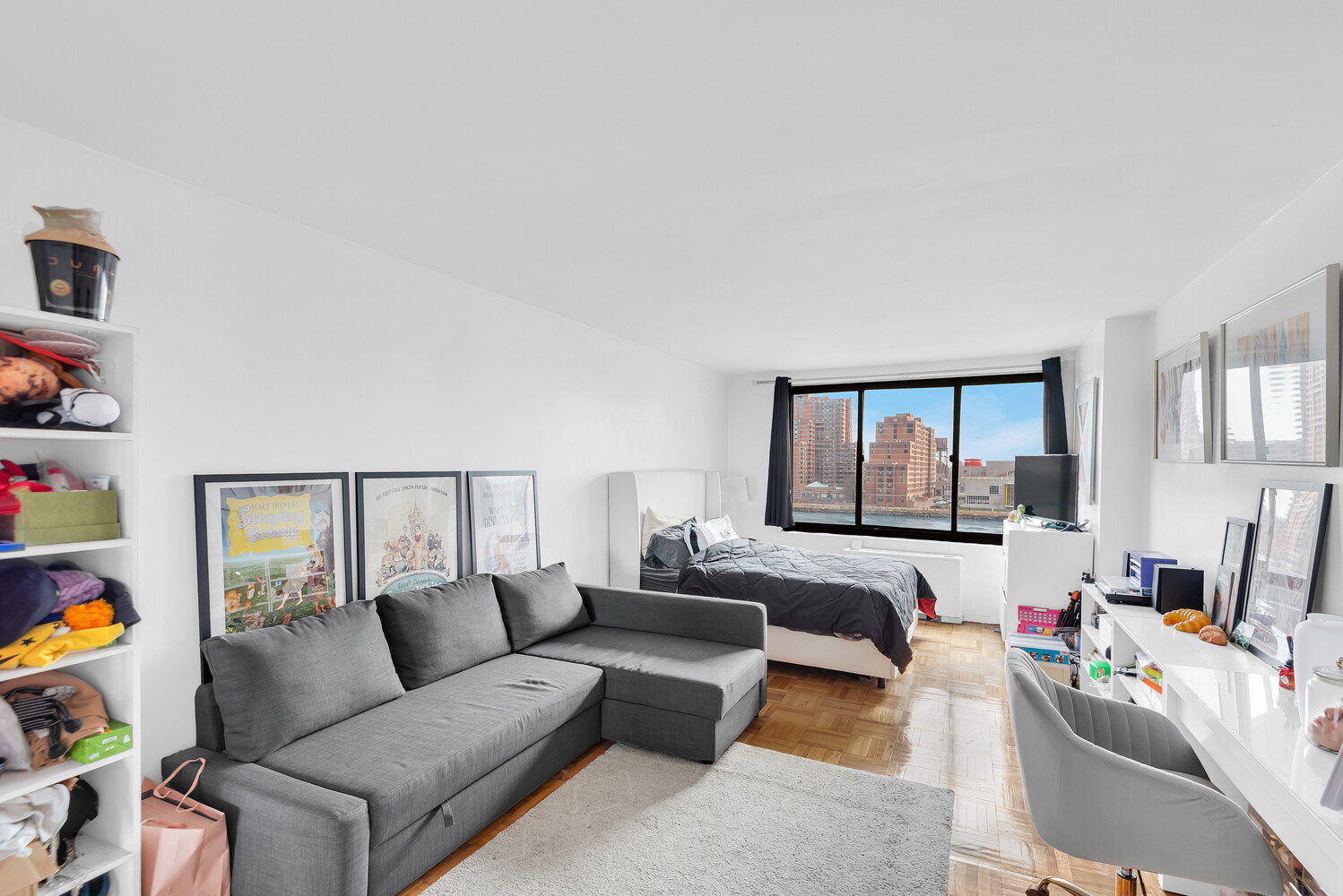 530 East 72nd Street, Unit 3F Manhattan, NY 10021 - Photo 10 of 16 a living room with furniture and a flat screen tv