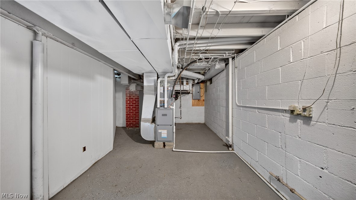 16811 Invermere Avenue Cleveland, OH 44128 - Photo 44 of 47 Unfinished basement with heating unit and electric panel