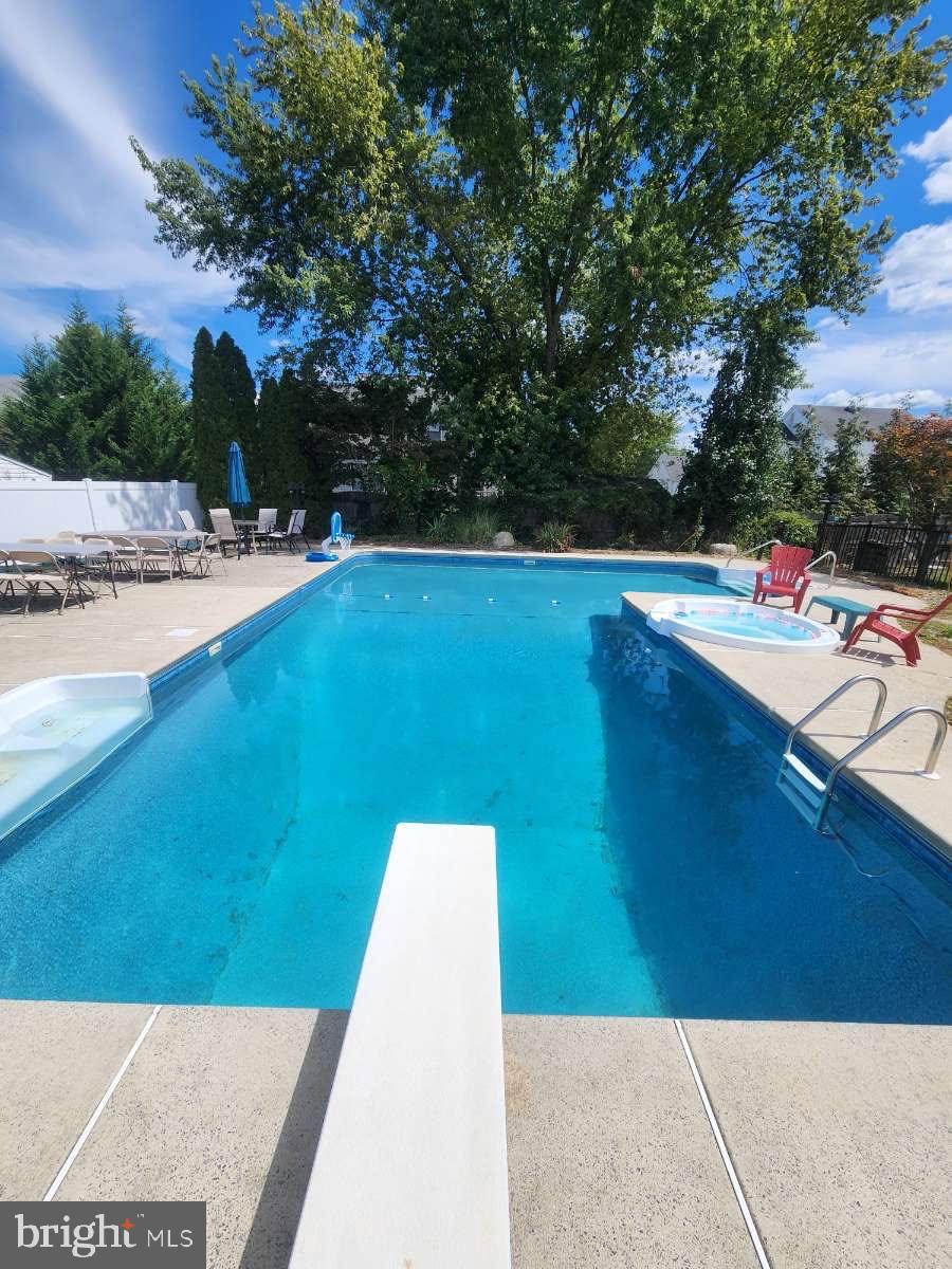 7 Hawthorn Way Clayton, NJ 08312 - Photo 11 of 11 a view of a swimming pool with an outdoor space