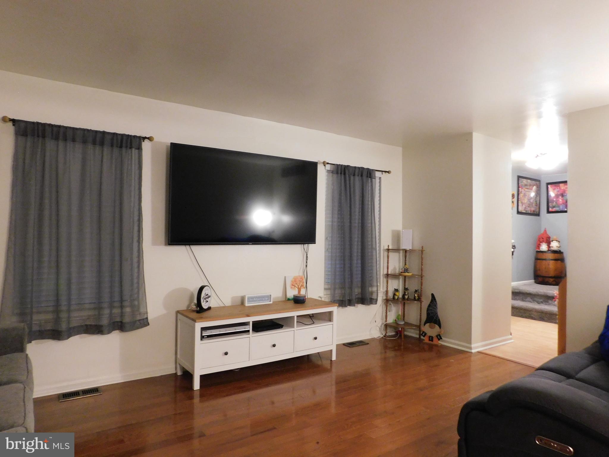 7 Hawthorn Way Clayton, NJ 08312 - Photo 4 of 11 a living room with furniture and a flat screen tv