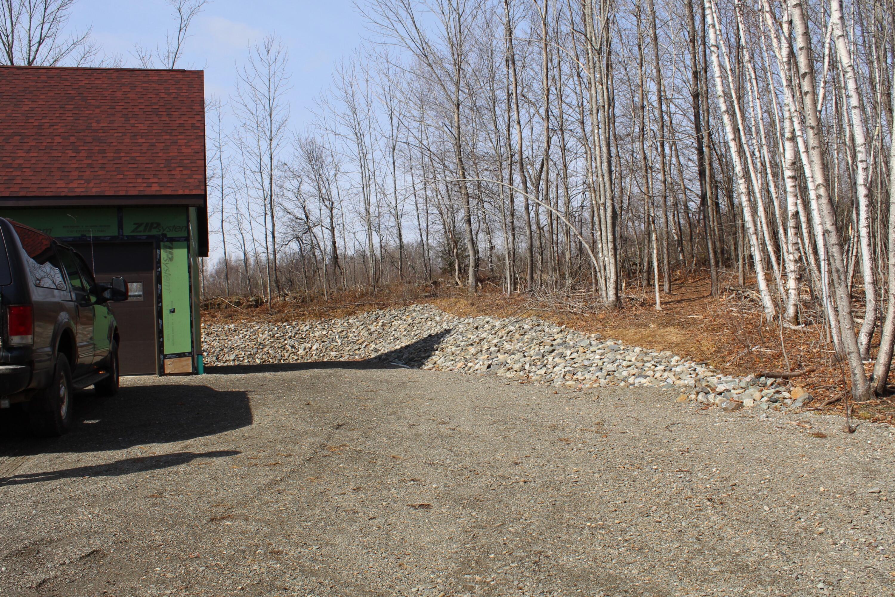896 Moosehead Trail Highway Jackson, ME 04921 - Photo 6 of 42 Around the garage stone work.