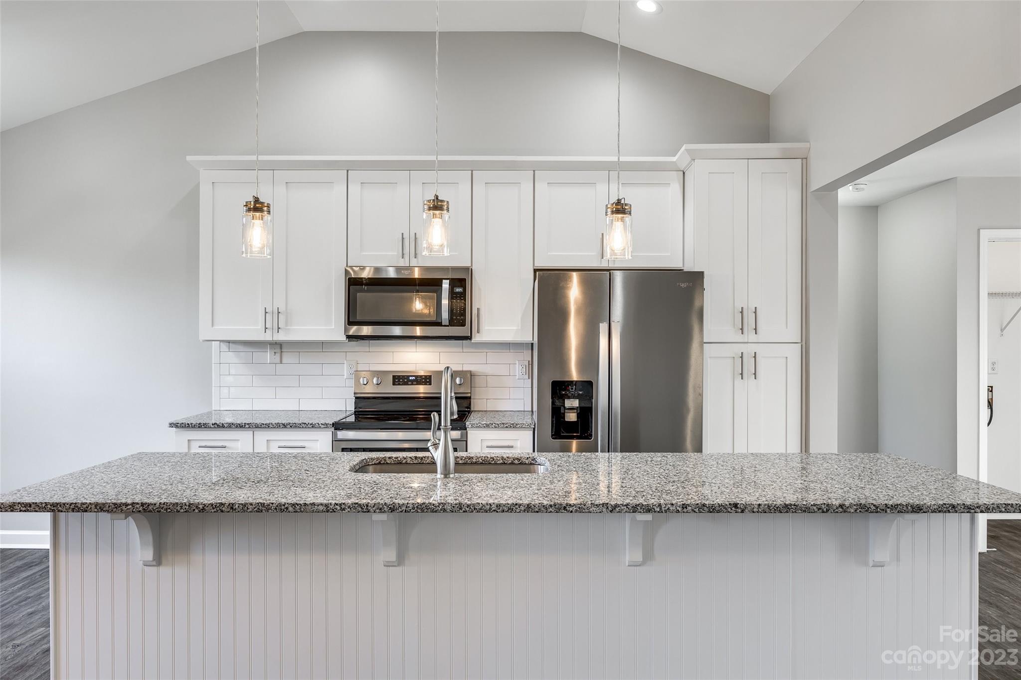 149 Airport Road Monroe, NC 28110 - Photo 13 of 41 a kitchen with stainless steel appliances granite countertop a refrigerator a stove and a sink