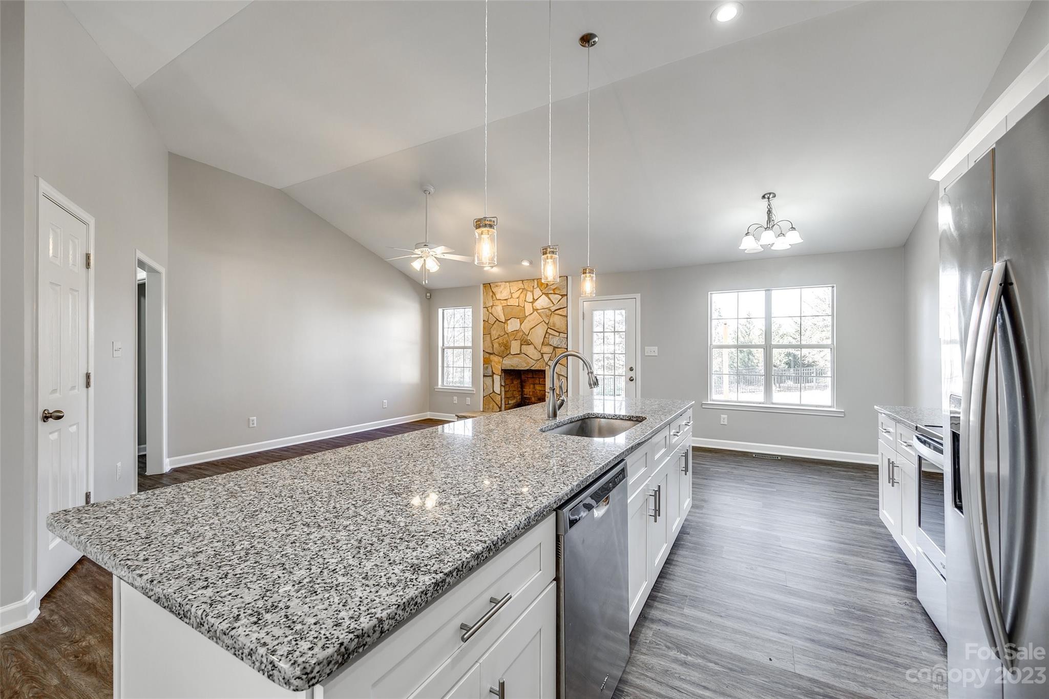 149 Airport Road Monroe, NC 28110 - Photo 14 of 41 a view of a kitchen cabinets kitchen island wooden floor and center island