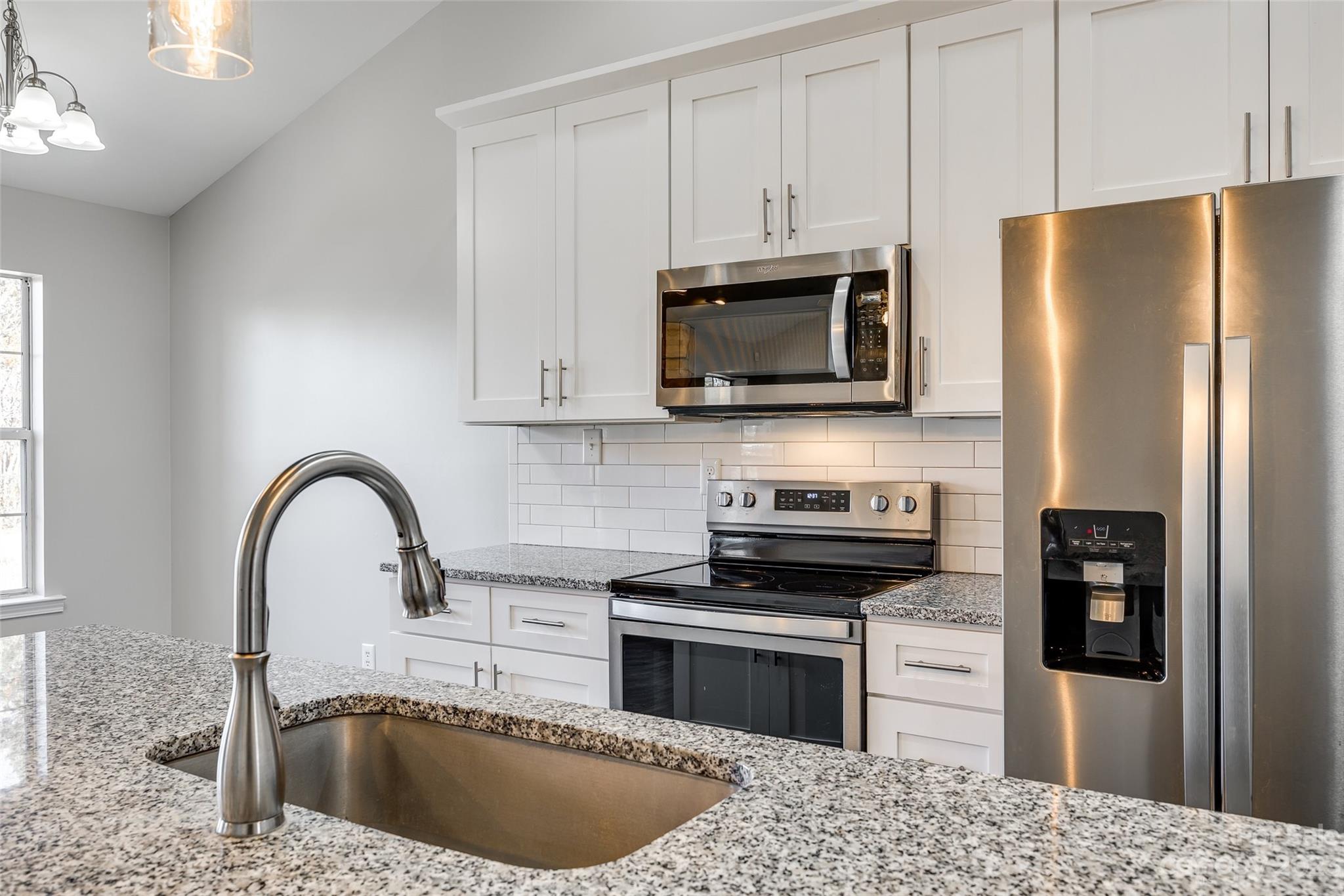 149 Airport Road Monroe, NC 28110 - Photo 16 of 41 a kitchen with a refrigerator sink and stove