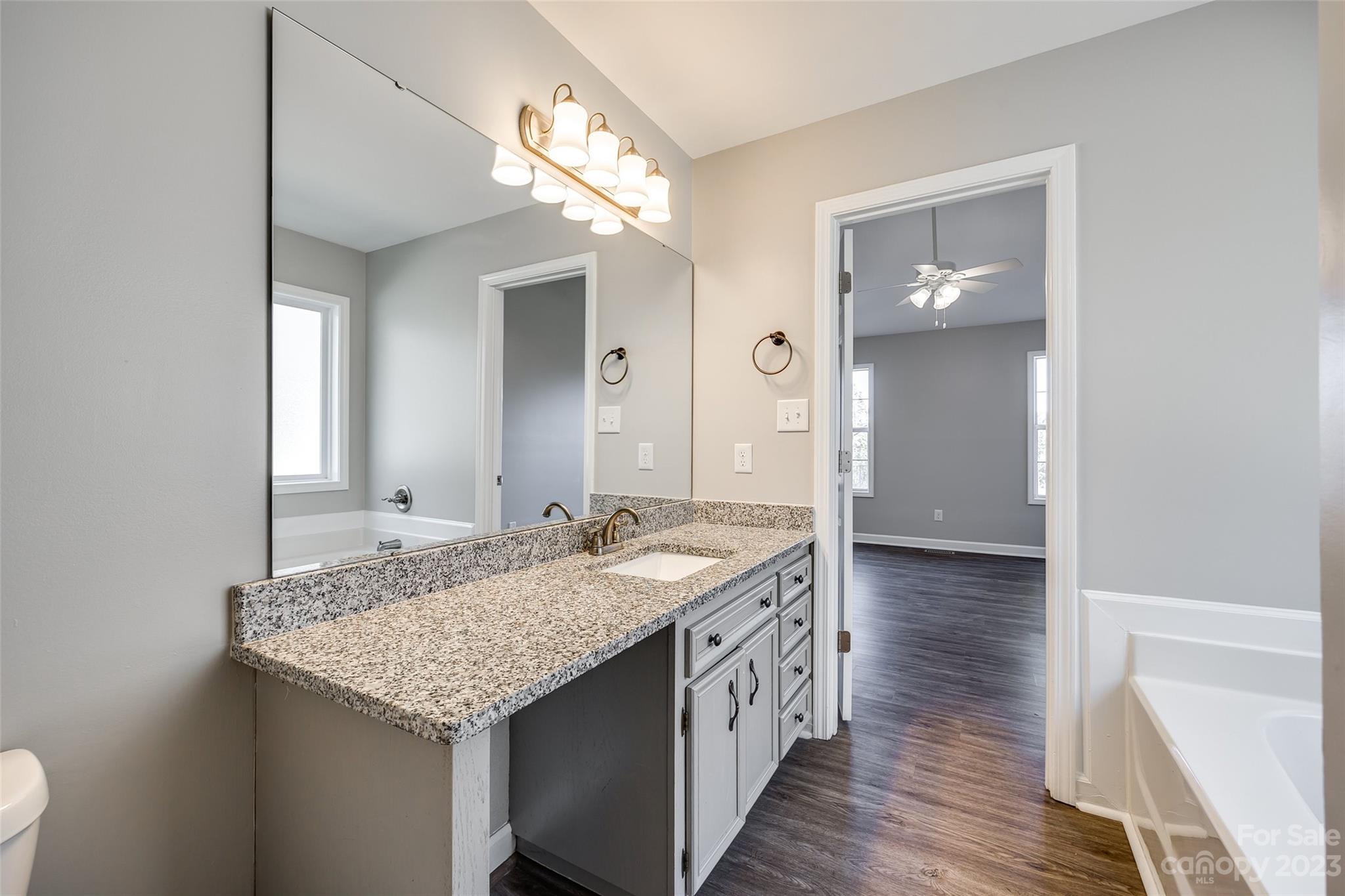 149 Airport Road Monroe, NC 28110 - Photo 21 of 41 a bathroom with a granite countertop sink and a mirror