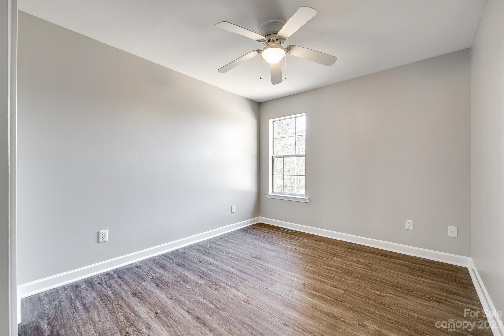 149 Airport Road Monroe, NC 28110 - Photo 24 of 41 wooden floor in an empty room with a window