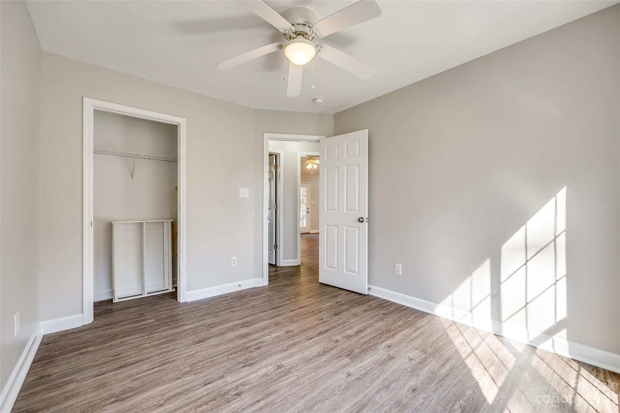 149 Airport Road Monroe, NC 28110 - Photo 27 of 41 a view of empty room with wooden floor and fan