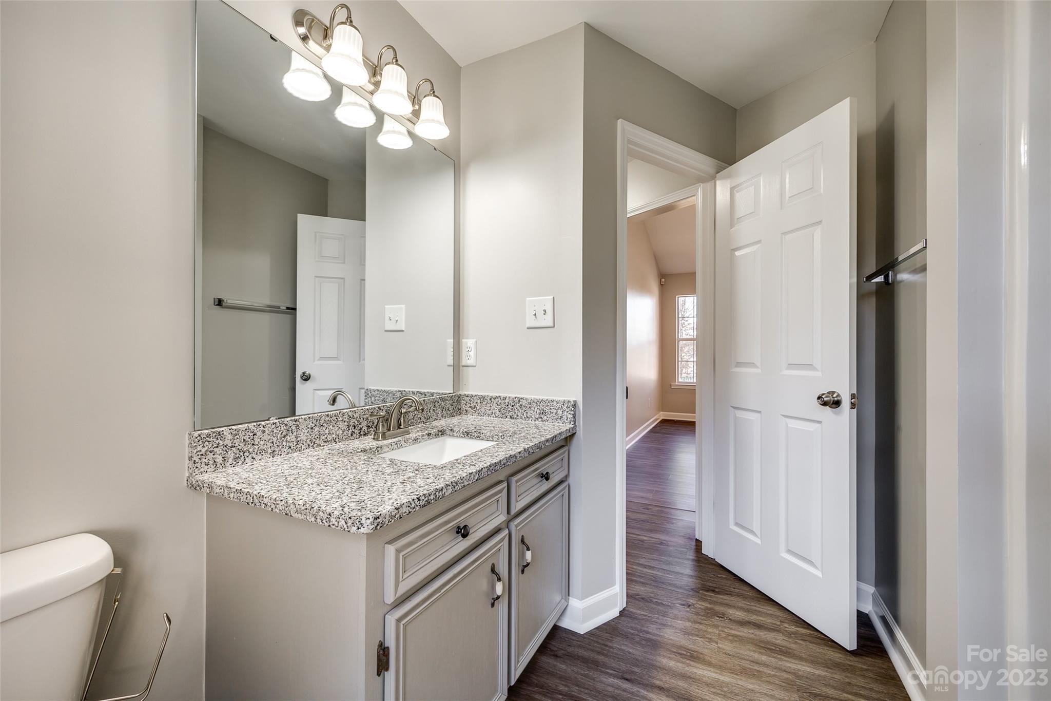 149 Airport Road Monroe, NC 28110 - Photo 29 of 41 a bathroom with a granite countertop sink and a mirror