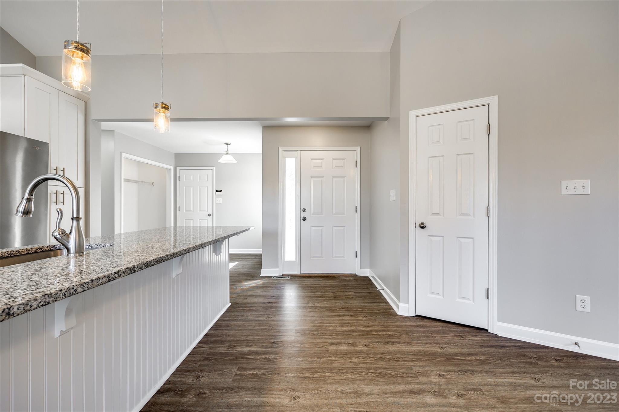 149 Airport Road Monroe, NC 28110 - Photo 3 of 41 a view of a large kitchen with wooden floor and a sink
