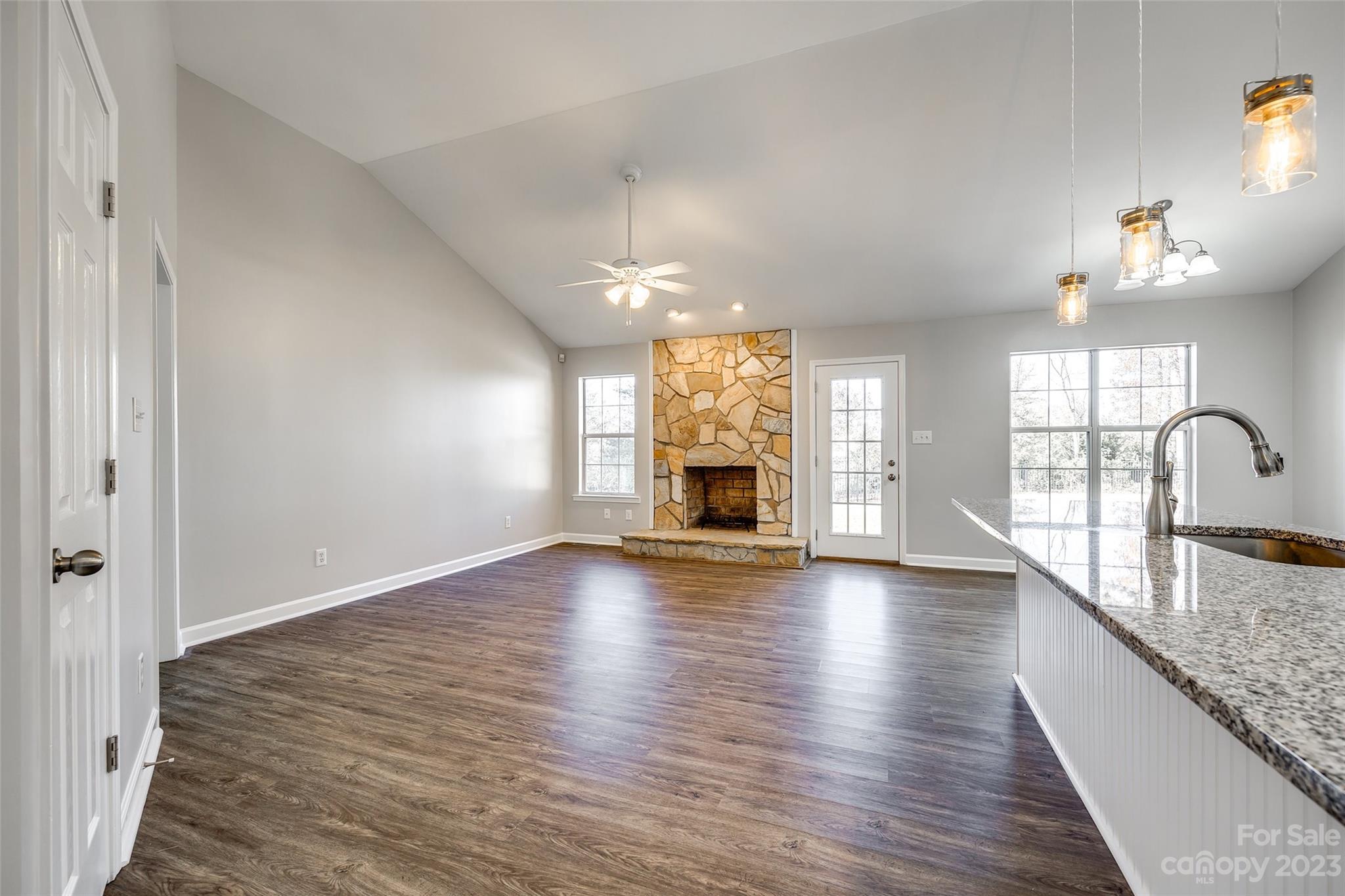 149 Airport Road Monroe, NC 28110 - Photo 4 of 41 a view of empty room with wooden floor and fireplace