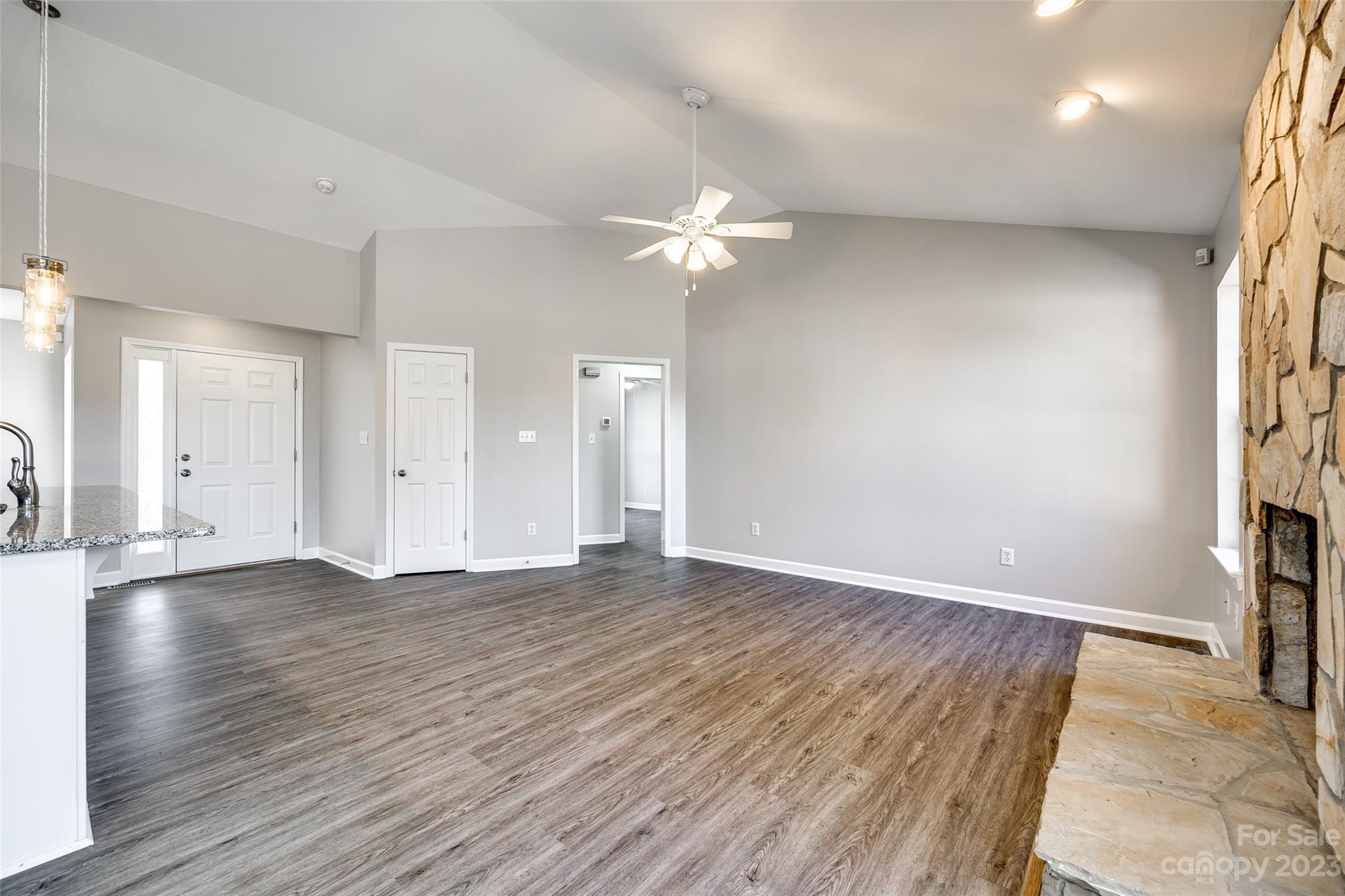 149 Airport Road Monroe, NC 28110 - Photo 5 of 41 a view of an empty room with a window and a kitchen