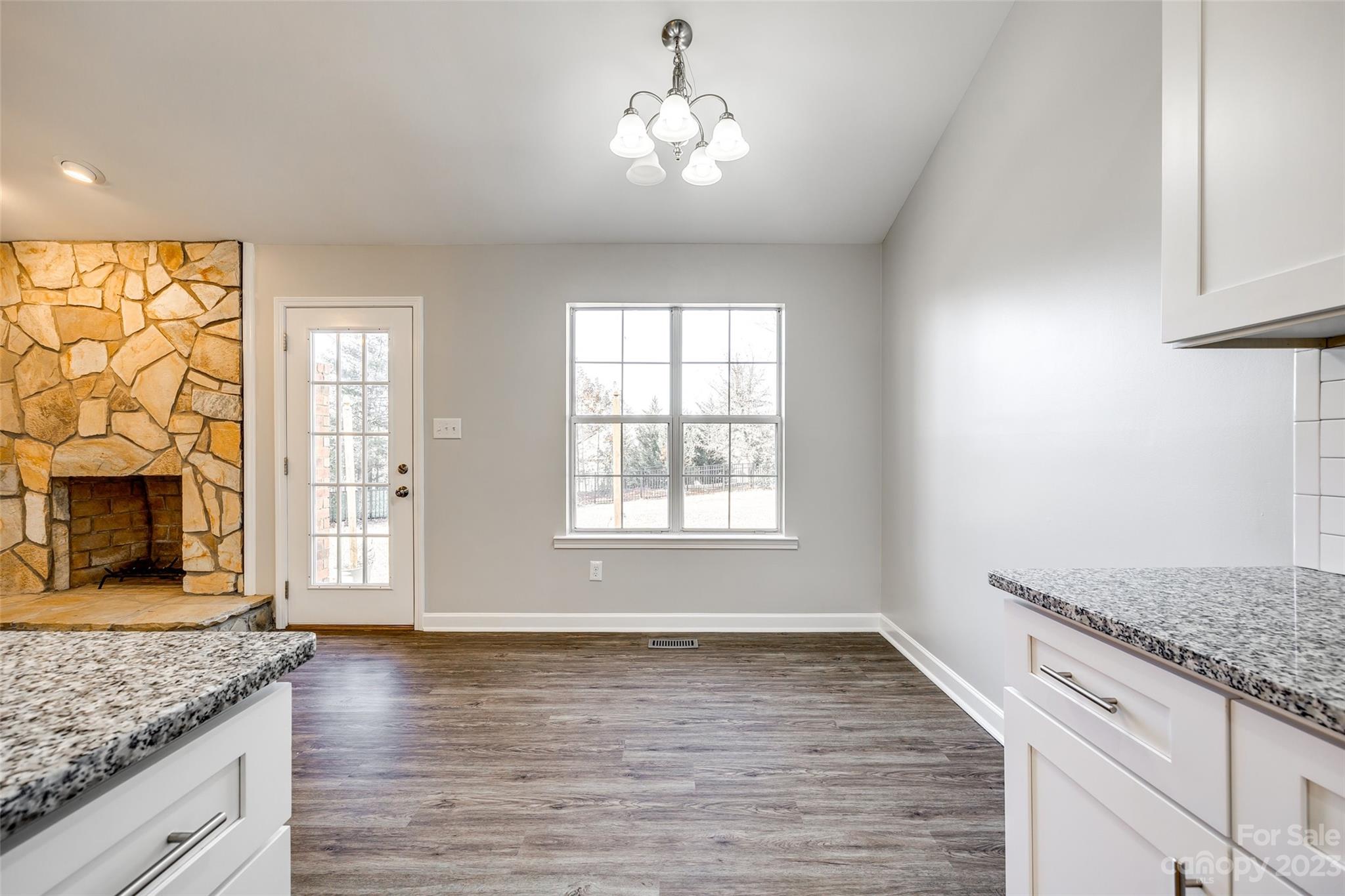 149 Airport Road Monroe, NC 28110 - Photo 10 of 41 an empty room with wooden floor and windows