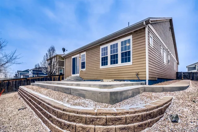 a view of a house with roof and sitting area
