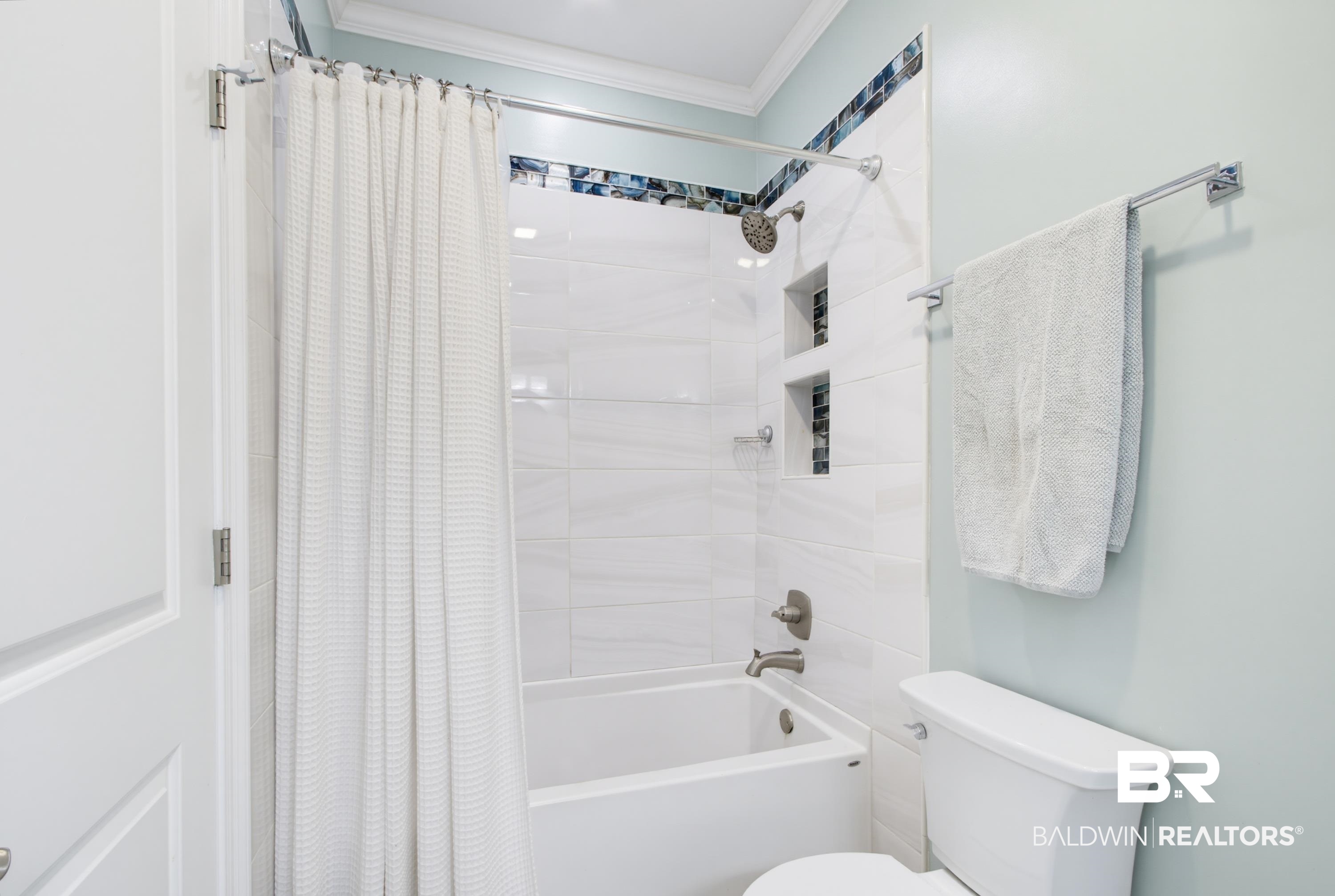 7472 Coopers Landing Road Foley, AL 36535 - Photo 24 of 40 Bathroom featuring a white tub and shower combination with white tile surround