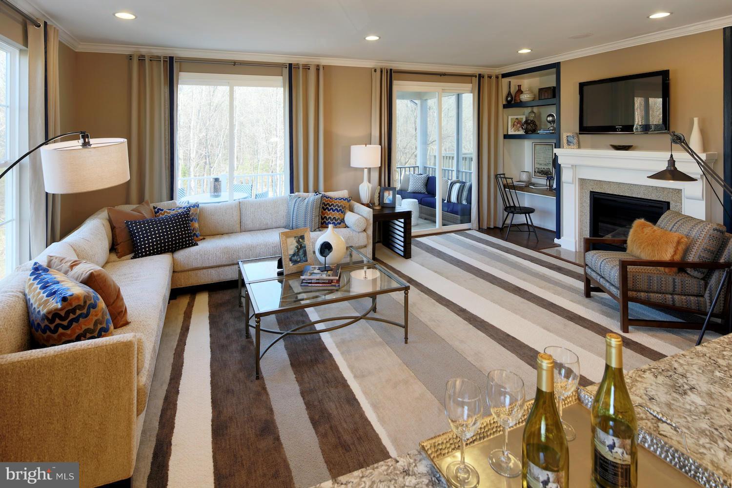9057 Connor House Road Manassas, VA 20111 - Photo 4 of 10 a living room with furniture and a fireplace