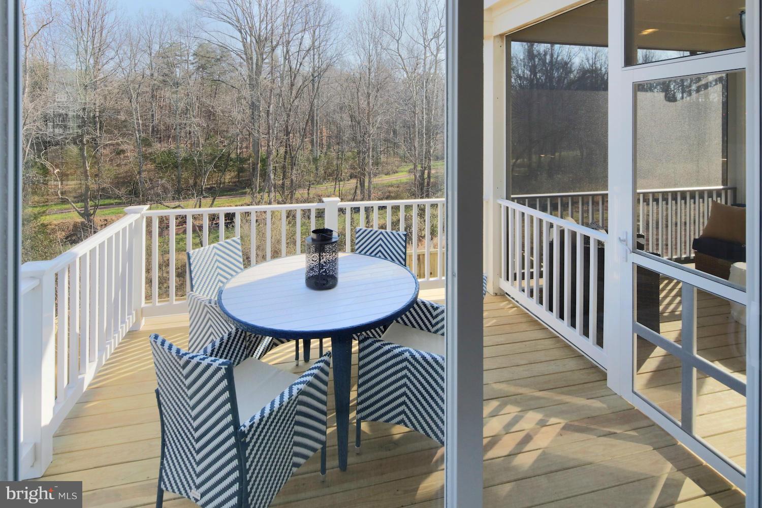 9057 Connor House Road Manassas, VA 20111 - Photo 9 of 10 a view of a balcony with a table and chairs