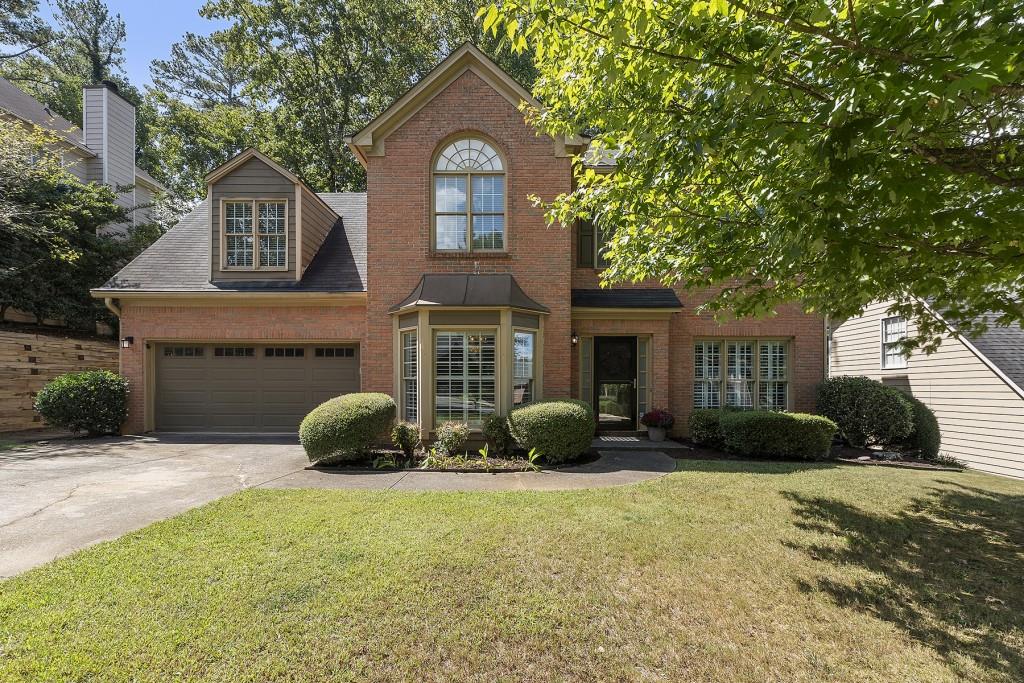 12100 Leeward Walk Circle Alpharetta, GA 30005 - Photo 1 of 1 a front view of a house with a yard
