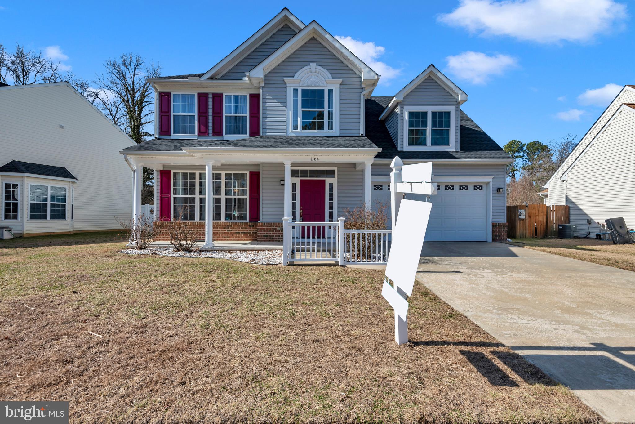 1104 Ruddy Duck Court Denton, MD 21629 - Photo 2 of 50 a front view of a house with garden