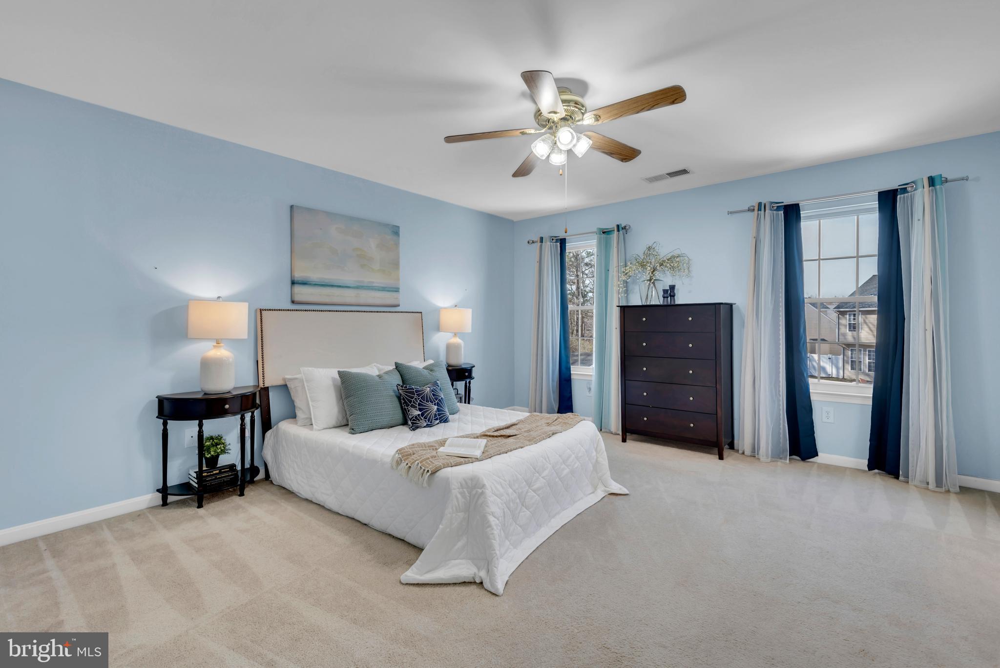 1104 Ruddy Duck Court Denton, MD 21629 - Photo 26 of 50 a bedroom with a bed and a chandelier