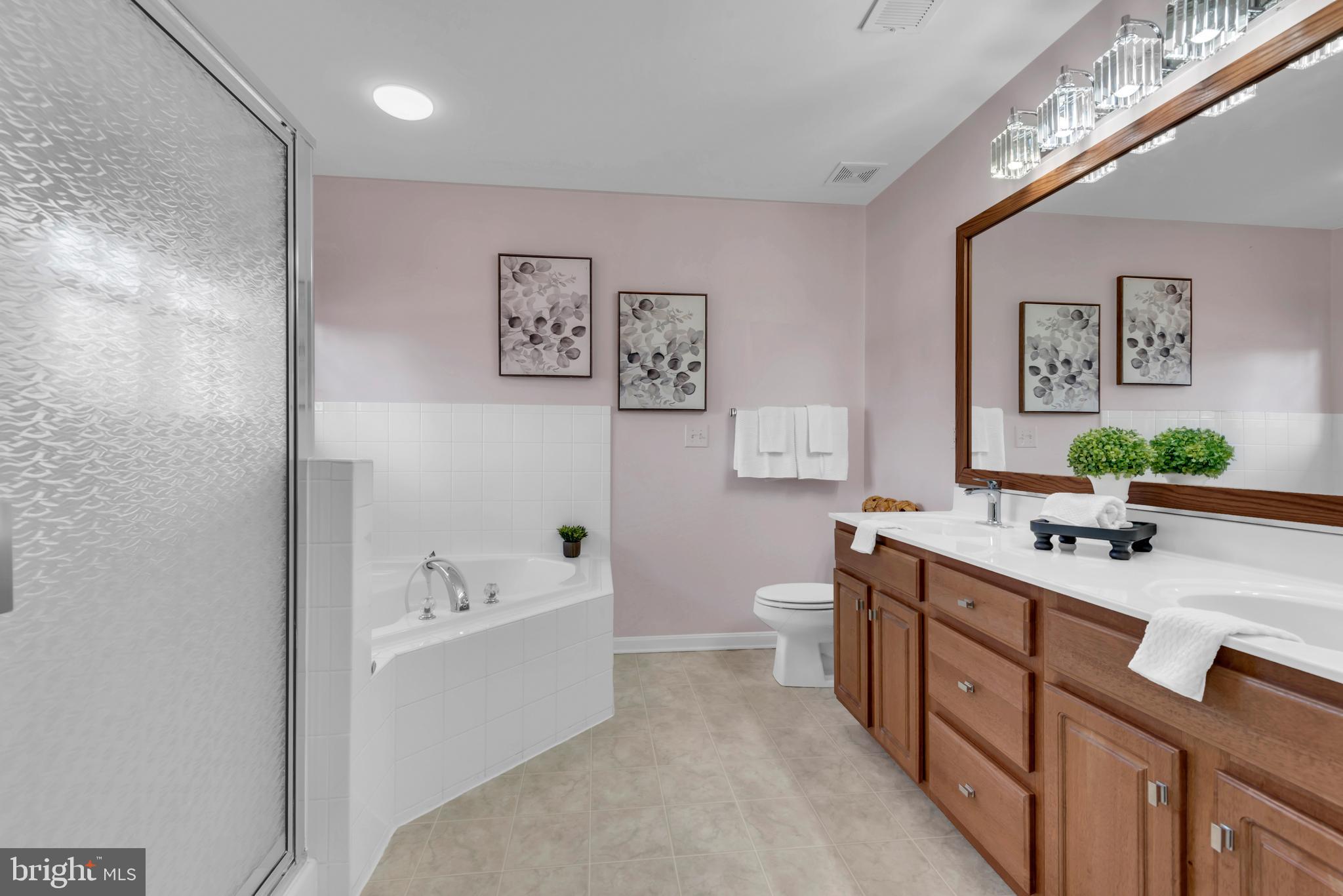 1104 Ruddy Duck Court Denton, MD 21629 - Photo 30 of 50 a spacious bathroom with a tub sink and mirror