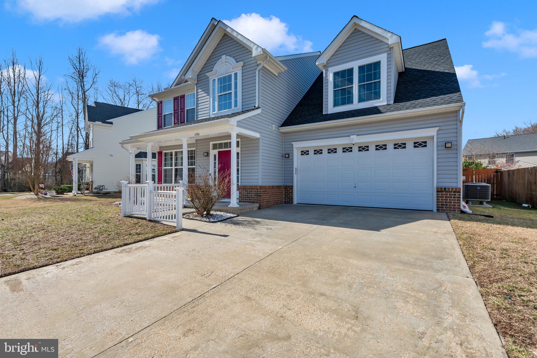 1104 Ruddy Duck Court Denton, MD 21629 - Photo 48 of 50 a front view of a house with a yard and garage