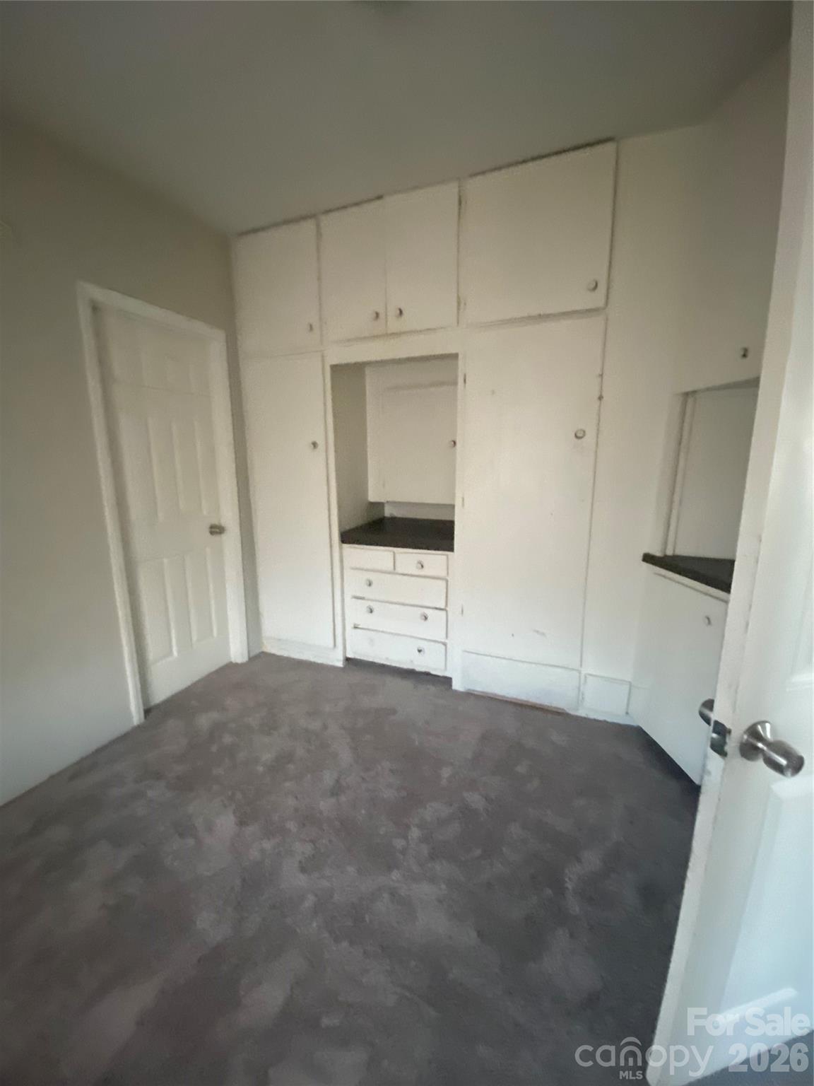 303 Rogers Lake Road Kannapolis, NC 28081 - Photo 11 of 20 a view of an empty room with a cabinet