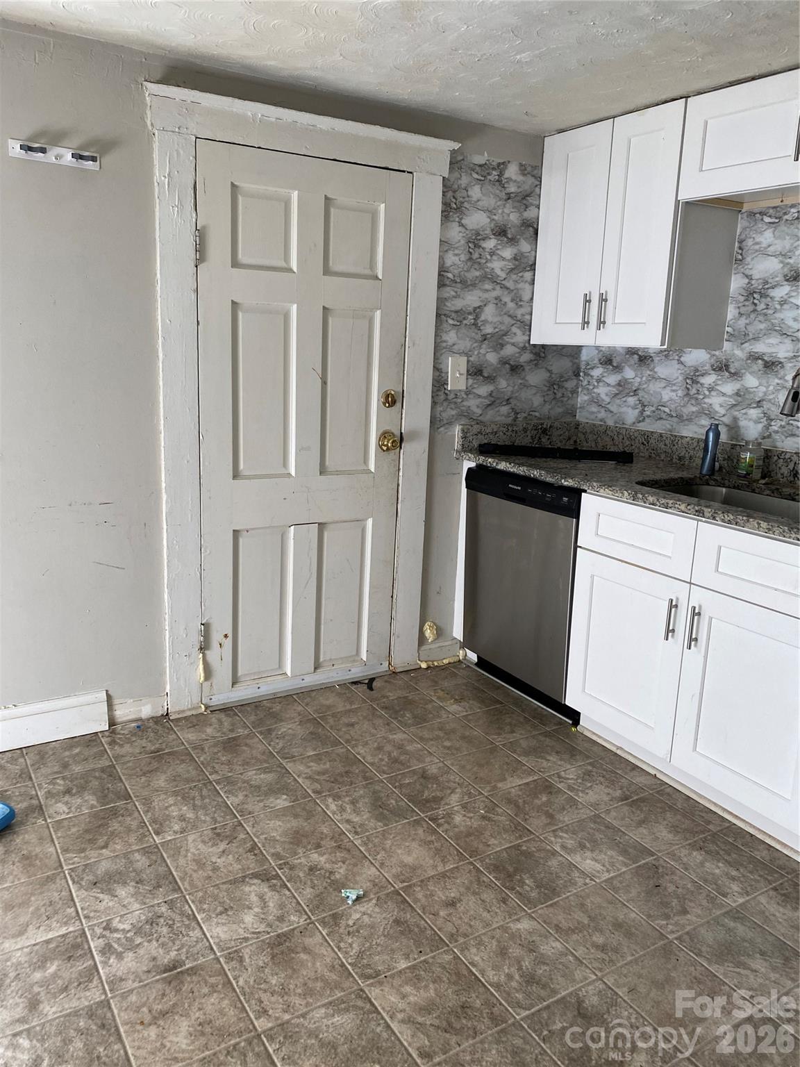 303 Rogers Lake Road Kannapolis, NC 28081 - Photo 17 of 20 a view of a kitchen with white cabinets