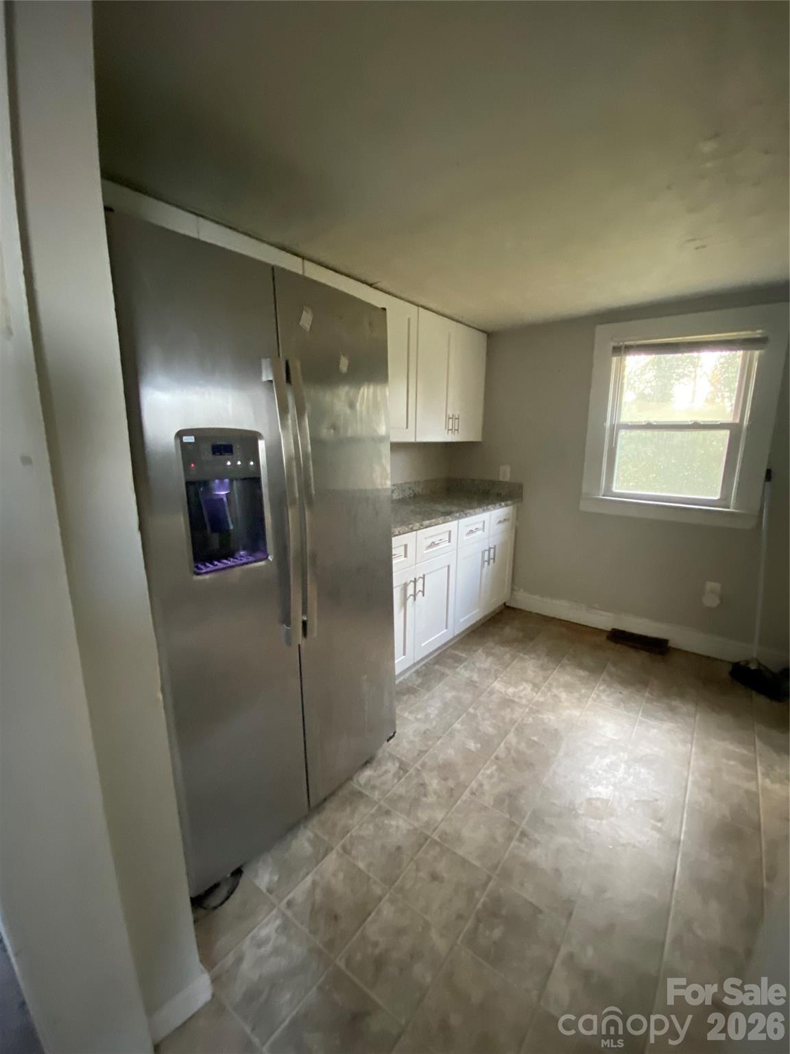 303 Rogers Lake Road Kannapolis, NC 28081 - Photo 18 of 20 a view of a kitchen with a sink cabinet and a window