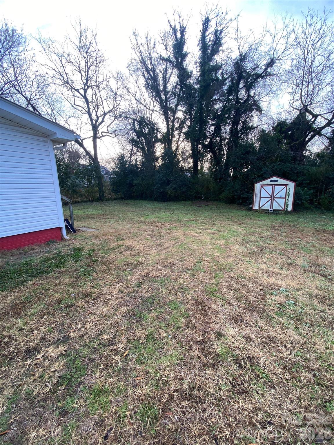 303 Rogers Lake Road Kannapolis, NC 28081 - Photo 5 of 20 a backyard of a house with lots of green space
