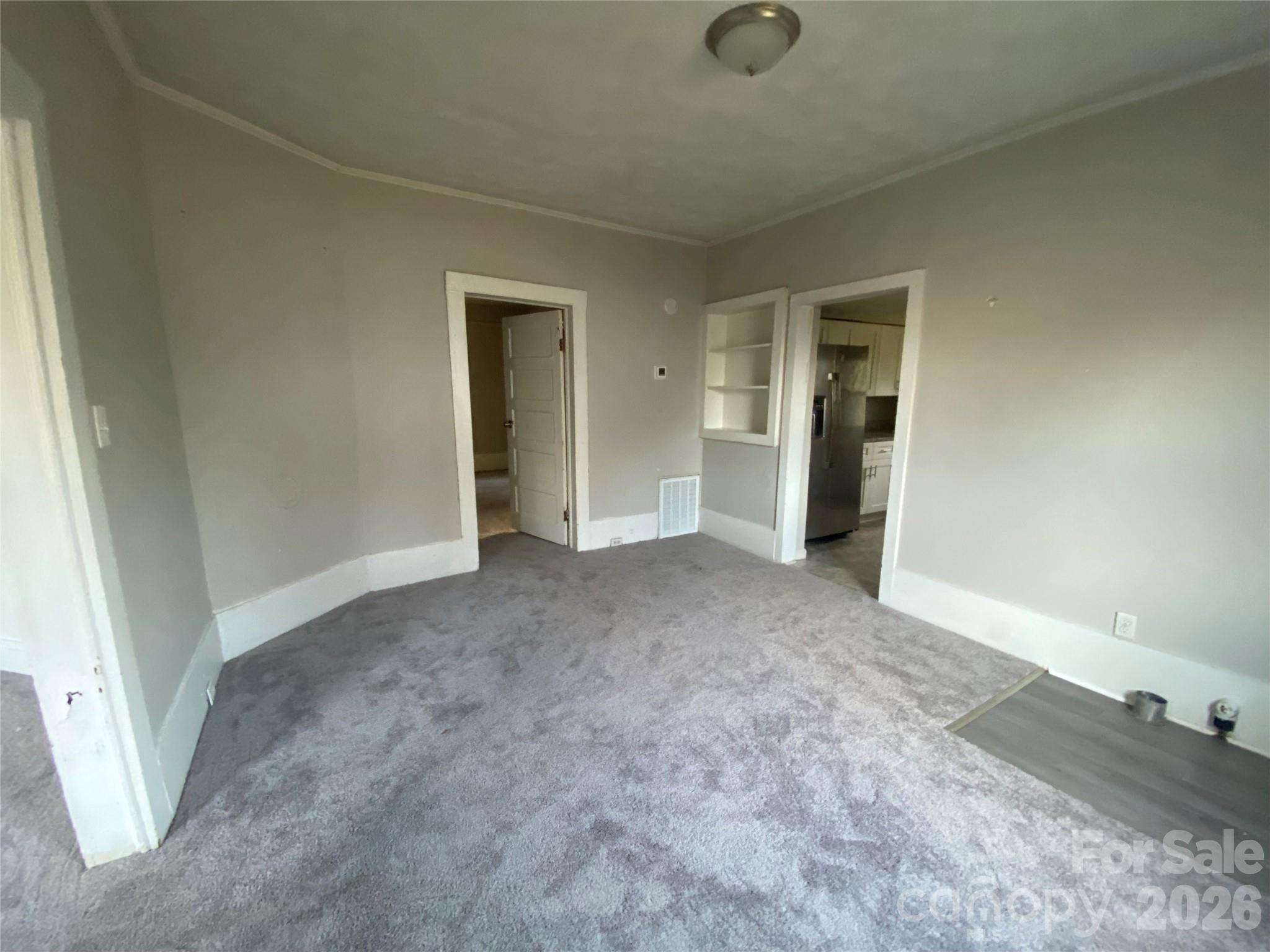 303 Rogers Lake Road Kannapolis, NC 28081 - Photo 8 of 20 an empty room with a natural light