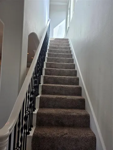 a view of a kitchen with a sink cabinets and a floor to ceiling window