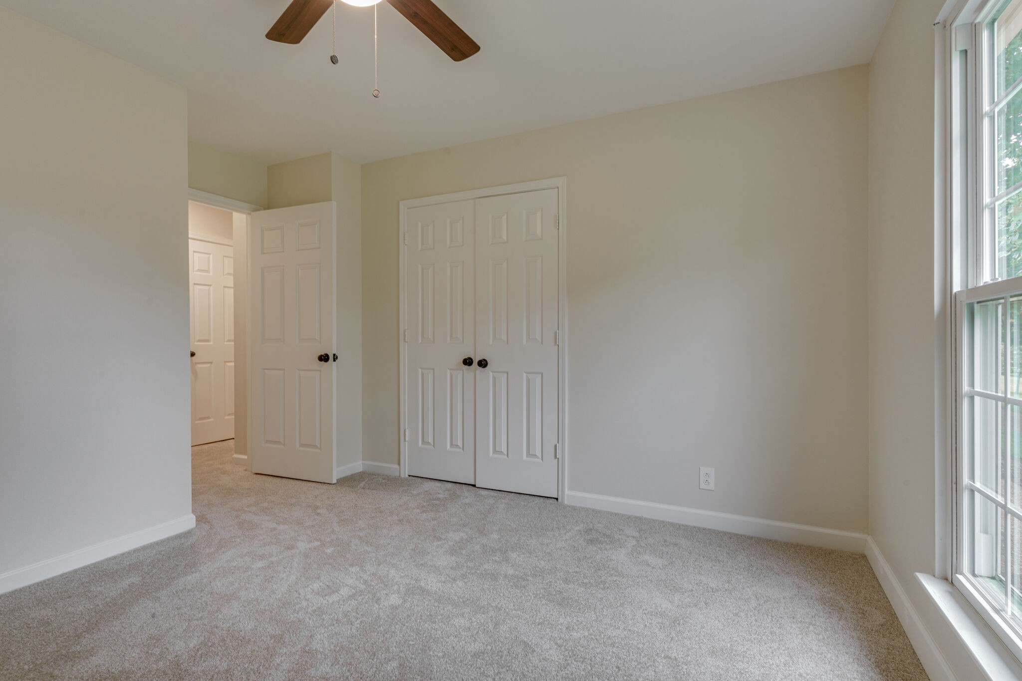 950 General George Patton Road Nashville, TN 37221 - Photo 16 of 34 an empty room with chandelier fan and windows