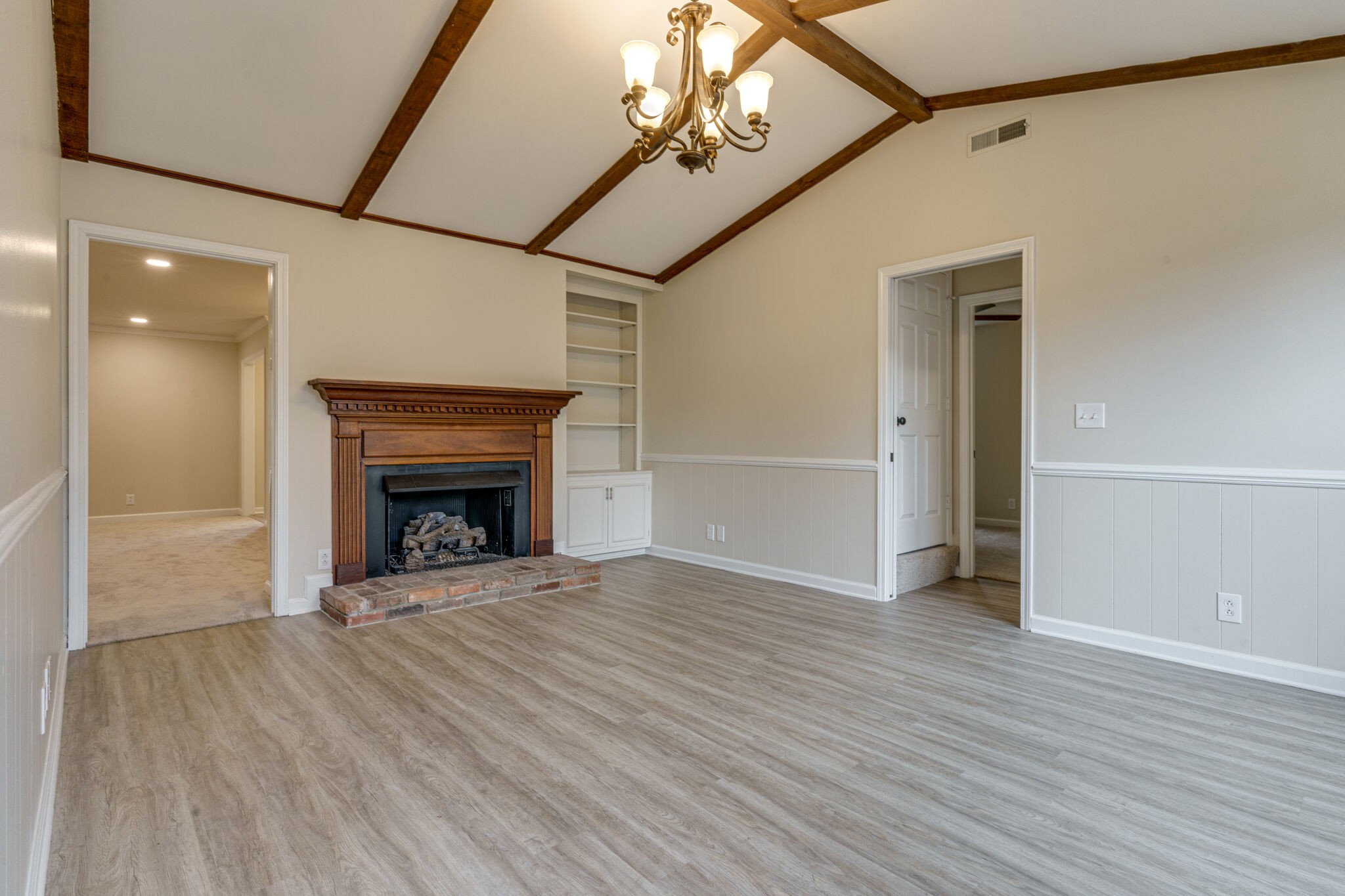 950 General George Patton Road Nashville, TN 37221 - Photo 3 of 34 a view of an empty room with wooden floor fireplace and a window