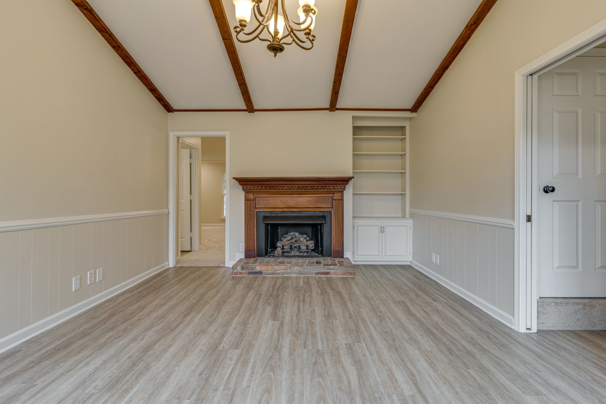 950 General George Patton Road Nashville, TN 37221 - Photo 23 of 34 a view of an empty room with wooden floor fireplace and a window