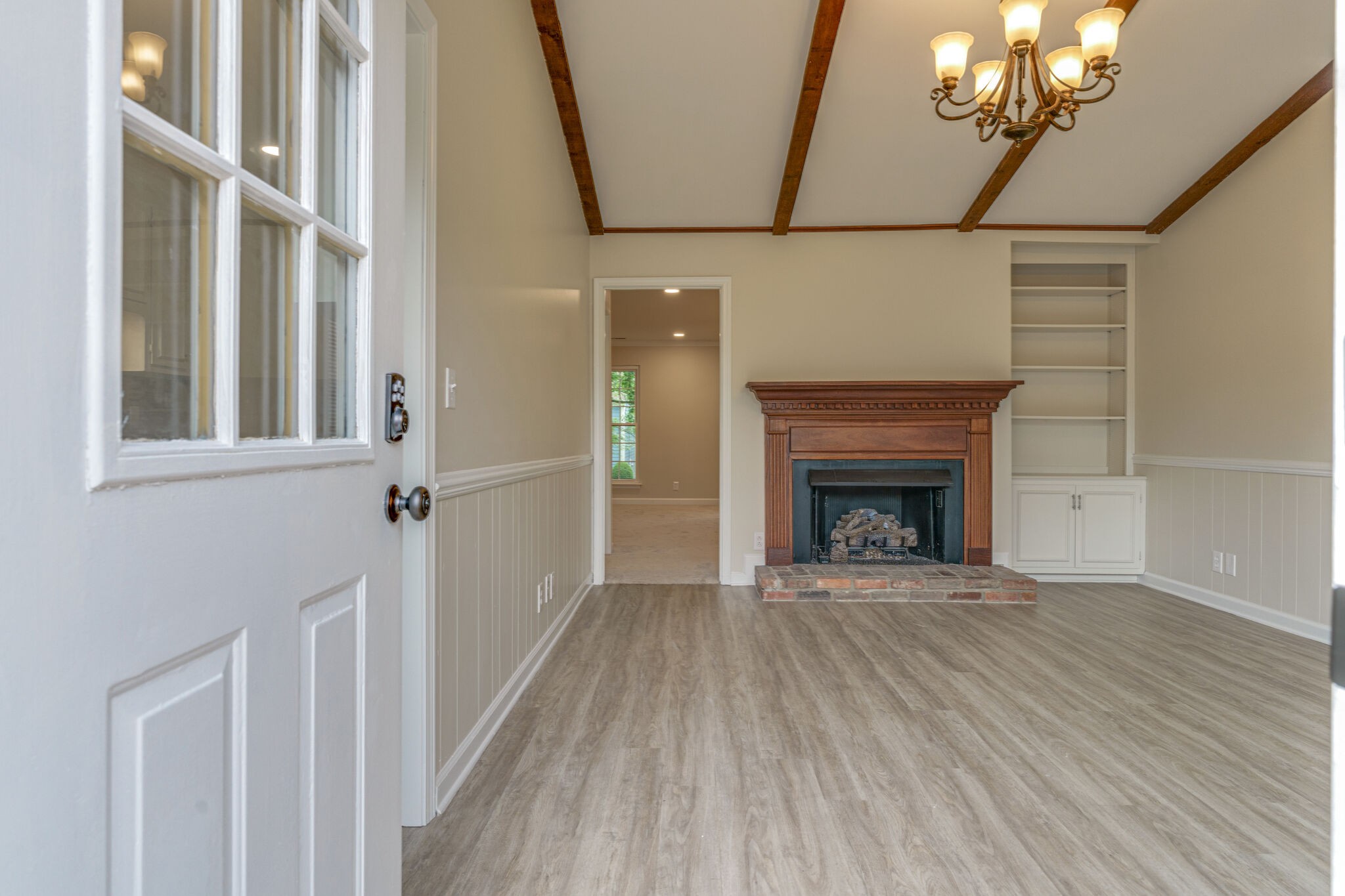 950 General George Patton Road Nashville, TN 37221 - Photo 24 of 34 a view of a livingroom with a fireplace and chandelier