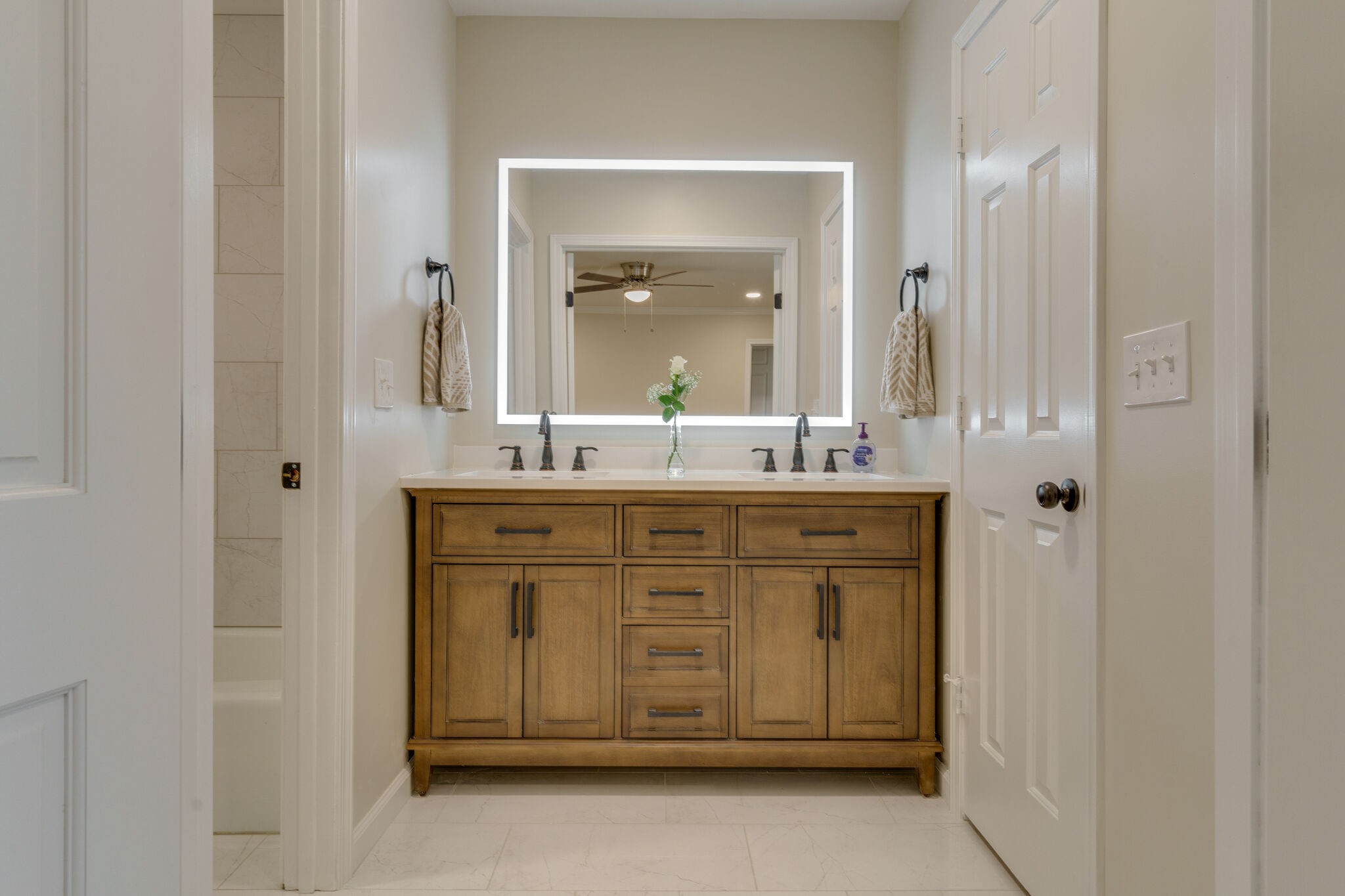 950 General George Patton Road Nashville, TN 37221 - Photo 30 of 34 a bathroom with a granite countertop sink vanity and mirror