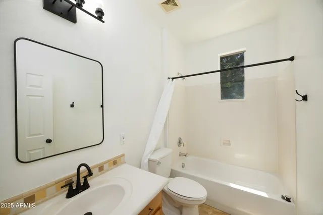 a view of kitchen with granite countertop cabinets and white appliances
