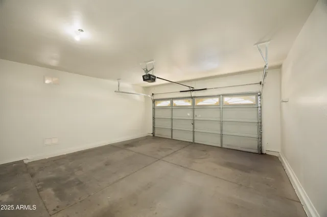 an empty room with a empty space and windows