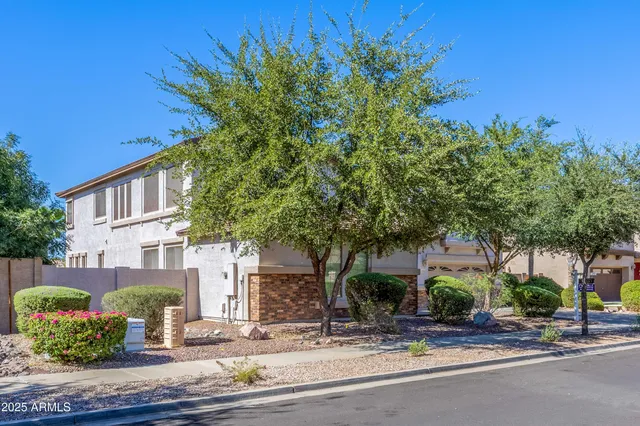 a view of a house with a garage and chair