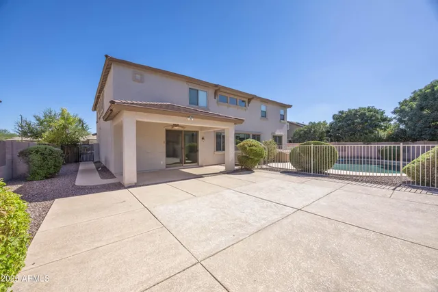 a view of a swimming pool with a patio