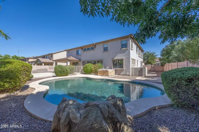 a view of backyard with outdoor seating