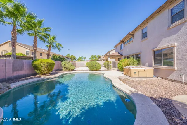 a view of a swimming pool with a patio