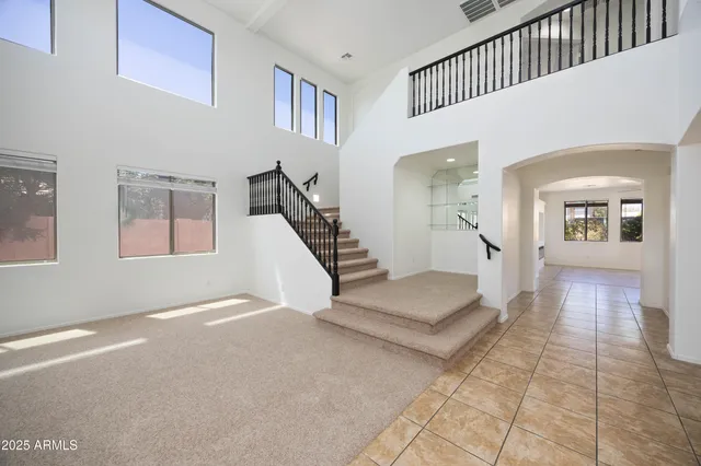 a view of a livingroom with wooden floor and sink